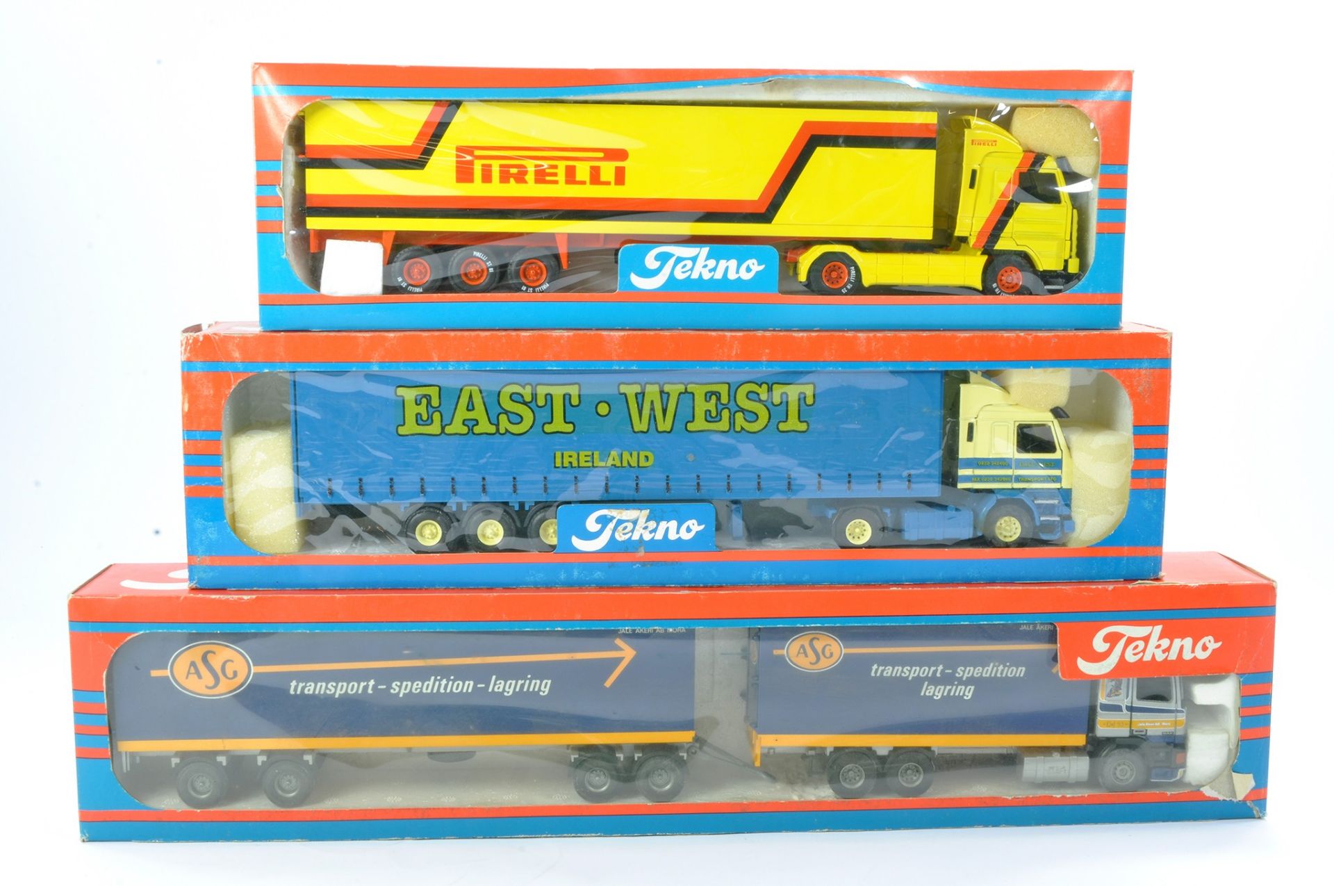 Tekno 1/50 Model Truck issues comprising 1) Scania Curtainside in the livery of East - West of
