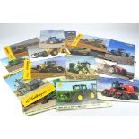 A group of tractor and machinery leaflets including Challenger, Versatile, New Holland and others.