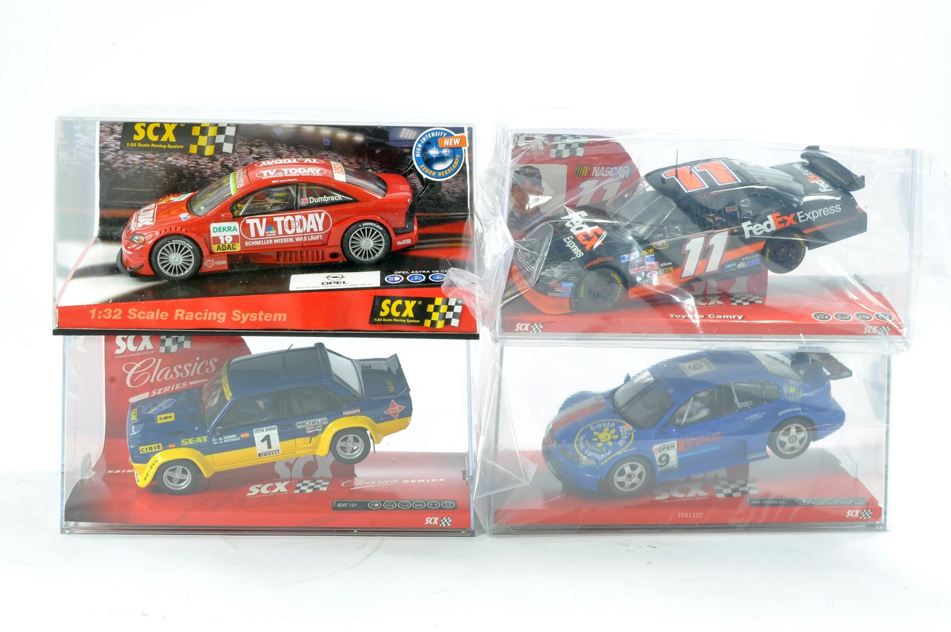 Slot Car SCX 1/32 issues comprising No. 64110 Toyota Camry FEDEX, 63930 Seat Toledo GT, 61380 Opel