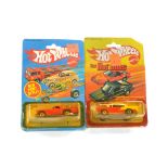 Hot Wheels duo of early carded issues comprising No. 9522 1957 Thunderbird plus No. 2523 1955 Chevy.