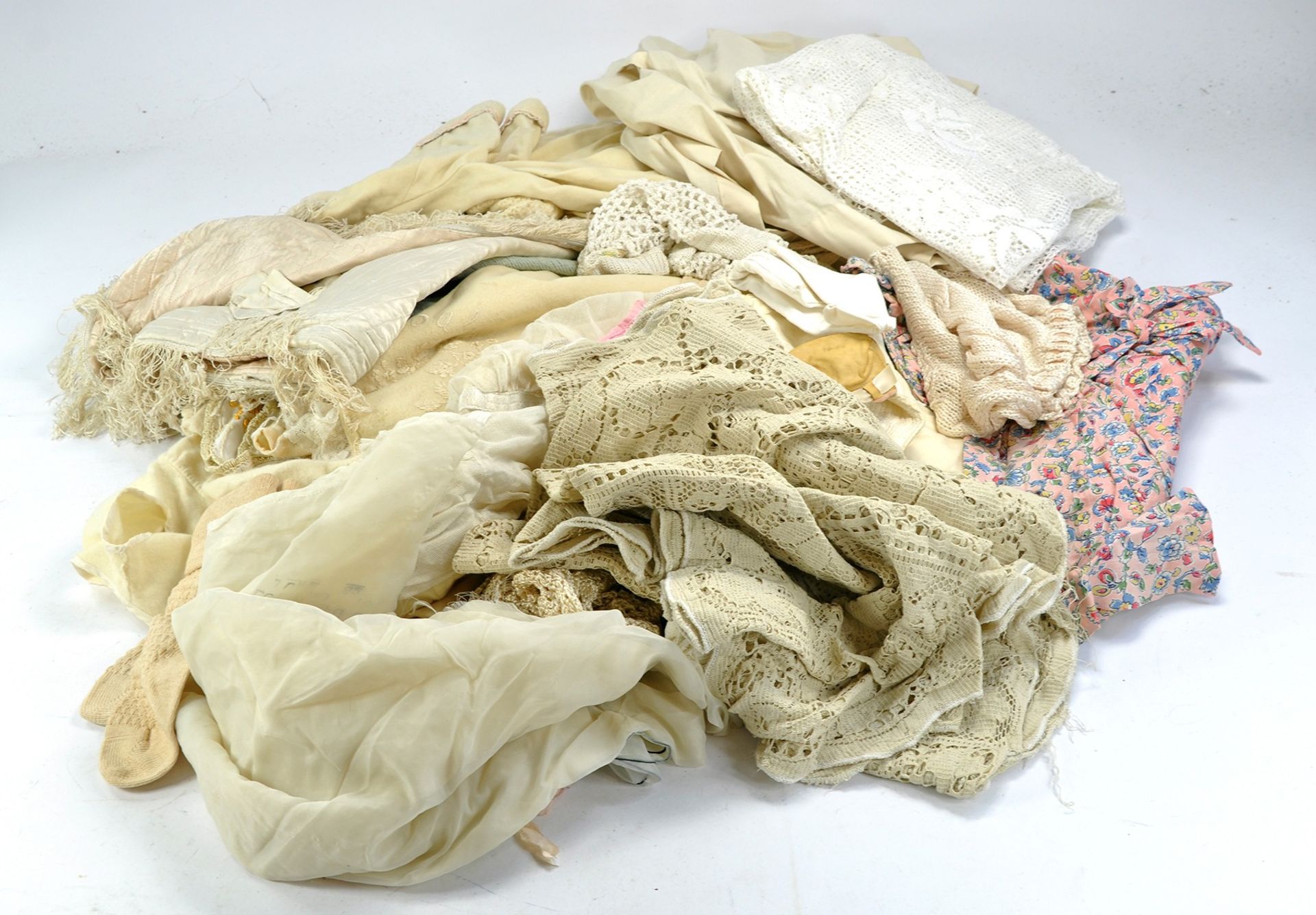 A large box of Dolls Clothing, some high quality hand made outfits, mostly in need of a clean.