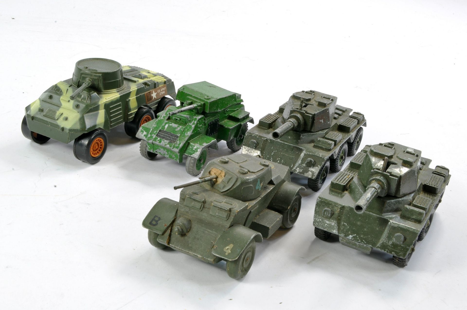 Assortment of worn military vehicles from various makers including Wooden Staghound Armoured