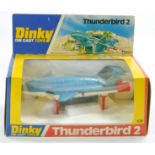 Dinky No. 106 Thunderbird 2. Metallic blue with red legs and rear thrusters. Excellent, no obvious