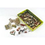 An assortment of vintage lead metal farm figures comprising various animals including several