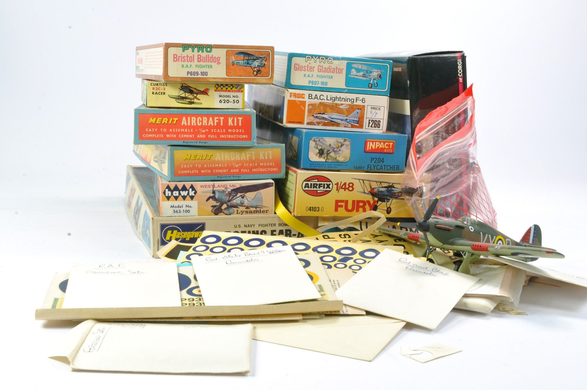 A collection of either started or incomplete plastic model kits plus diecast Spitfire plus large