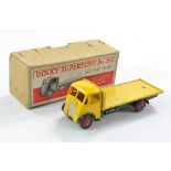Dinky No. 512 Guy Flat Truck Type One. Yellow cab and back, black chassis, silver trim, metal tow