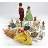 An attractive collection of ceramic / china / porcelain half dolls in various poses and sizes,