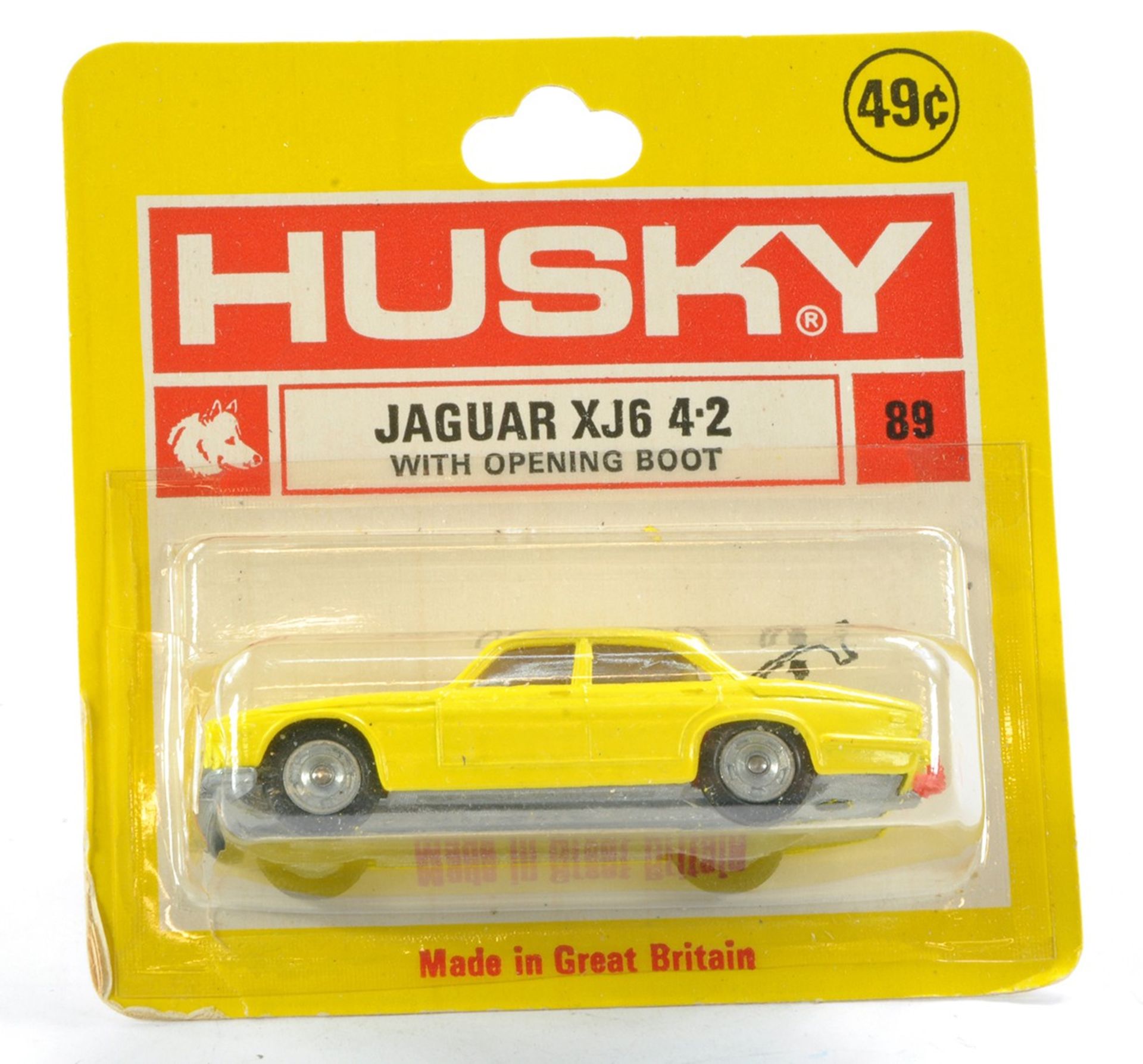 Husky No. 89 Jaguar XJ6. Yellow with red interior. Excellent, unopened card however bubble has crack
