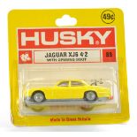 Husky No. 89 Jaguar XJ6. Yellow with red interior. Excellent, unopened card however bubble has crack