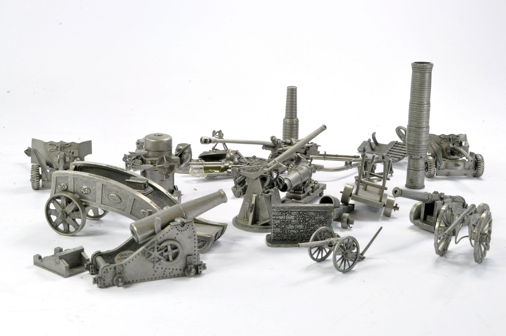 A small group of Pewter Military issues, Field Guns, AA Weaponry etc. Some signs of wear,