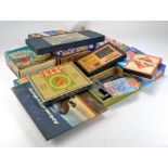 A collection of various vintage games including Sailor Buoy, Magic Robot, Monopoly, Round the