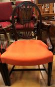 A set of six early 20th Century dining chairs in the Hepplewhite manner with oval backs and orange