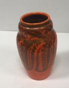 A Pilkington's Royal Lancastrian orange ground floral decorated vase,