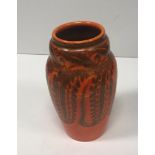 A Pilkington's Royal Lancastrian orange ground floral decorated vase,