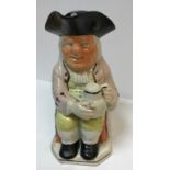 A 19th Century Staffordshire pottery Toby jug as "Toby Philpott seated with jug of ale on his left