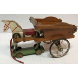 A circa 1930's painted wooden pull-along toy horse and cart, 35 cm long x 25.