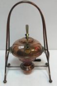 A circa 1900 copper spirit kettle in the manner of Christopher Dresser,