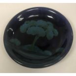 A Moorcroft moonlit pattern plate, with central tree decoration,