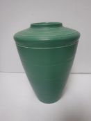 A Keith Murray for Wedgwood matt green glazed tapering vase with incised decoration,