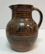 A Ray Finch Winchcombe Pottery brown glazed jug 24 cm high