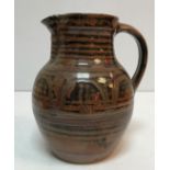 A Ray Finch Winchcombe Pottery brown glazed jug 24 cm high