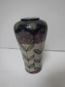 A Royal Doulton floral decorated baluster shaped vase,