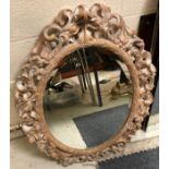 A modern oval wall mirror, the plate with bevelled edge,