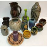 A collection of art pottery to include a Salkian Art Pottery dish with sgraffito decoration 19 cm