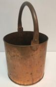 A copper swing handled bucket 28 cm high excluding handle and 28.