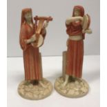 A pair of Royal Worcester James Hadley figures of musicians, one playing a tambourine,