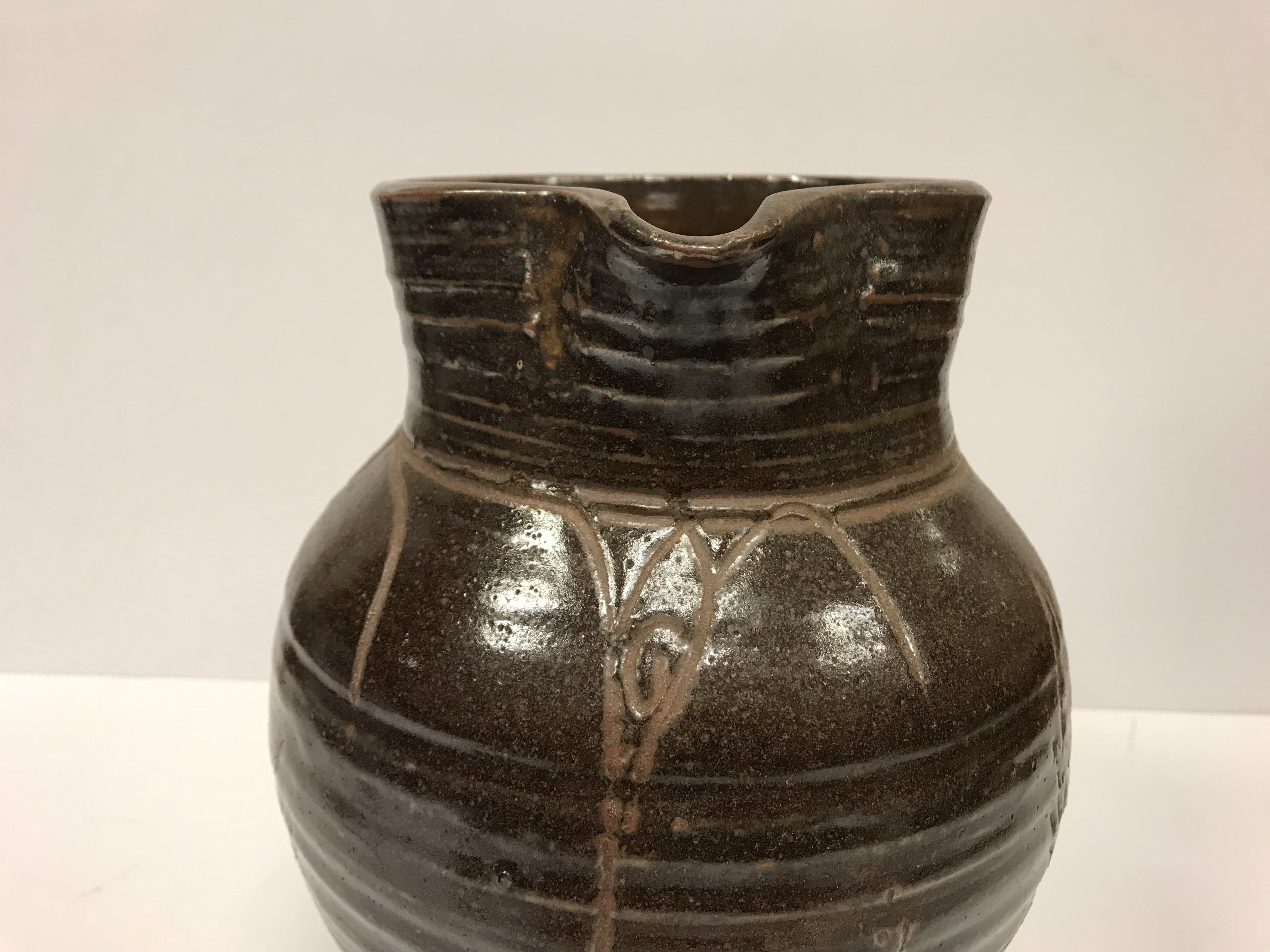 A Michael Cardew Wenfordbridge Pottery brown glazed ribbed jug with stylized floral spray - Image 6 of 22