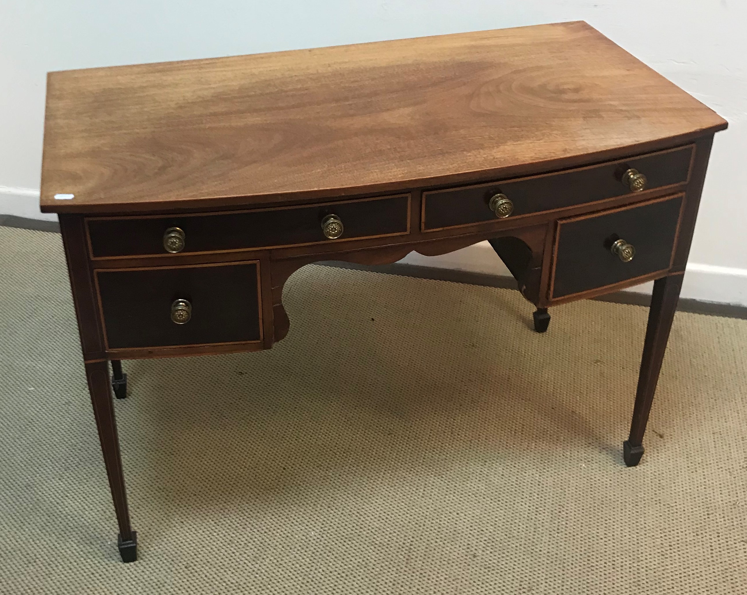 An Edwardian mahogany bow fronted side table with two slim drawers over two deep drawers raised on - Image 2 of 5