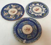 A collection of three Continental porcelain plates each depicting a crown to the centre highlighted