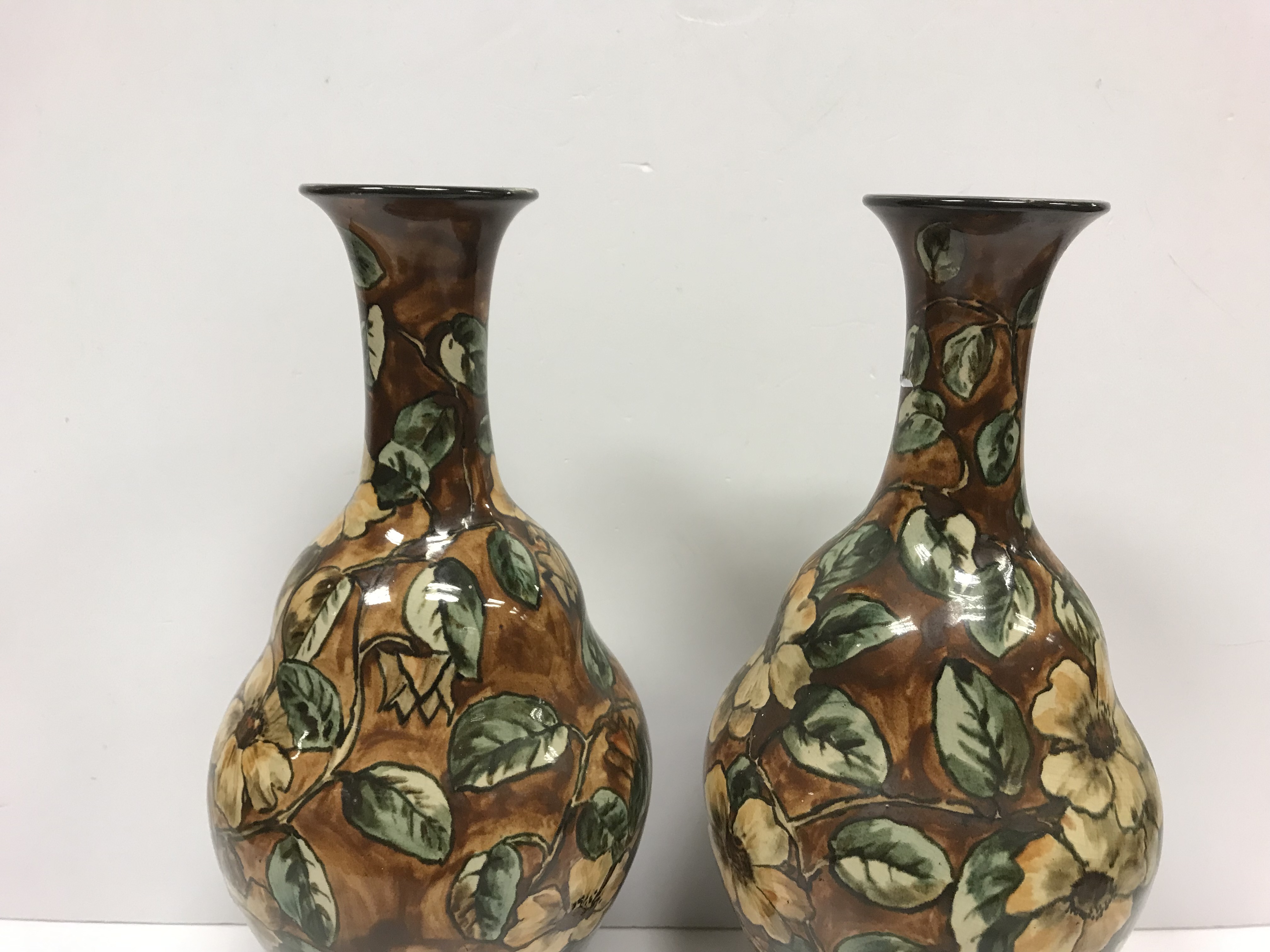 A pair of Doulton Lambeth faience ware vases, the brown ground set with floral decoration, - Image 6 of 22