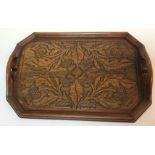 A wooden Arts & Crafts Scottish twin-handled tray with thistle decoration,