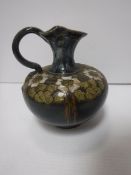 A Royal Doulton floral decorated jug by Eliza Simmance, bearing “ES” initials and No “396” to base,