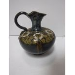A Royal Doulton floral decorated jug by Eliza Simmance, bearing “ES” initials and No “396” to base,
