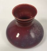 A Ruskin Pottery sang de boeuf vase of squat form stamped to base 15 cm high CONDITION