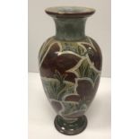 A Royal Doulton vase with Art Nouveau style floral incised decoration,