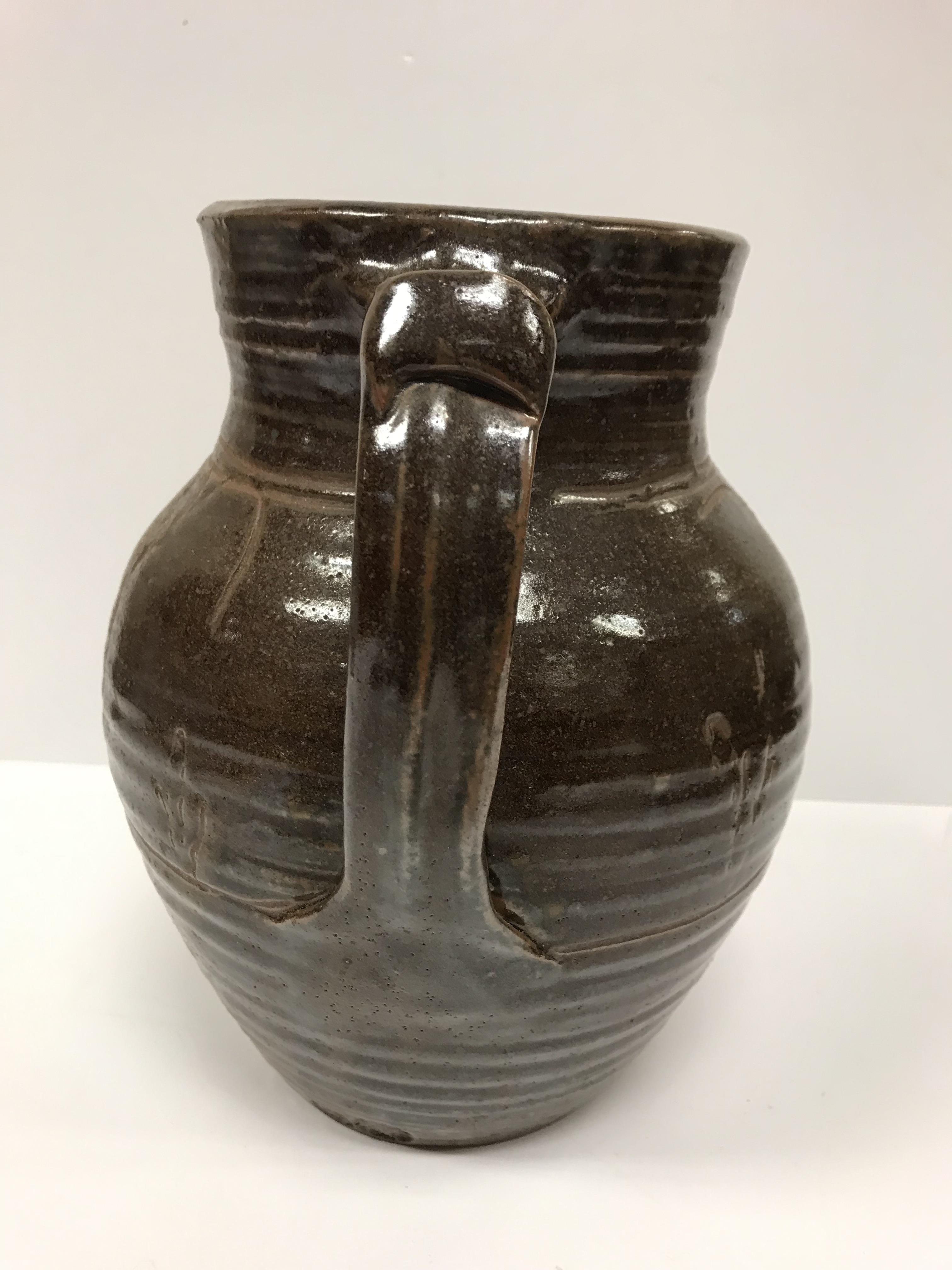 A Michael Cardew Wenfordbridge Pottery brown glazed ribbed jug with stylized floral spray - Image 11 of 22