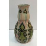 A Della Robbia stylised gourd shaped vase decorated by Cassandra (Cassie) Annie Walker with