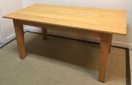 A modern pine farmhouse style kitchen table, the rectangular top on square supports 91 cm x 167.
