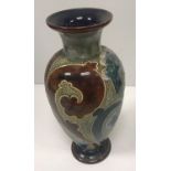 A Royal Doulton vase with Art Nouveau style floral incised decoration,