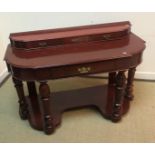 An Edwardian mahogany bow fronted side table with two slim drawers over two deep drawers raised on