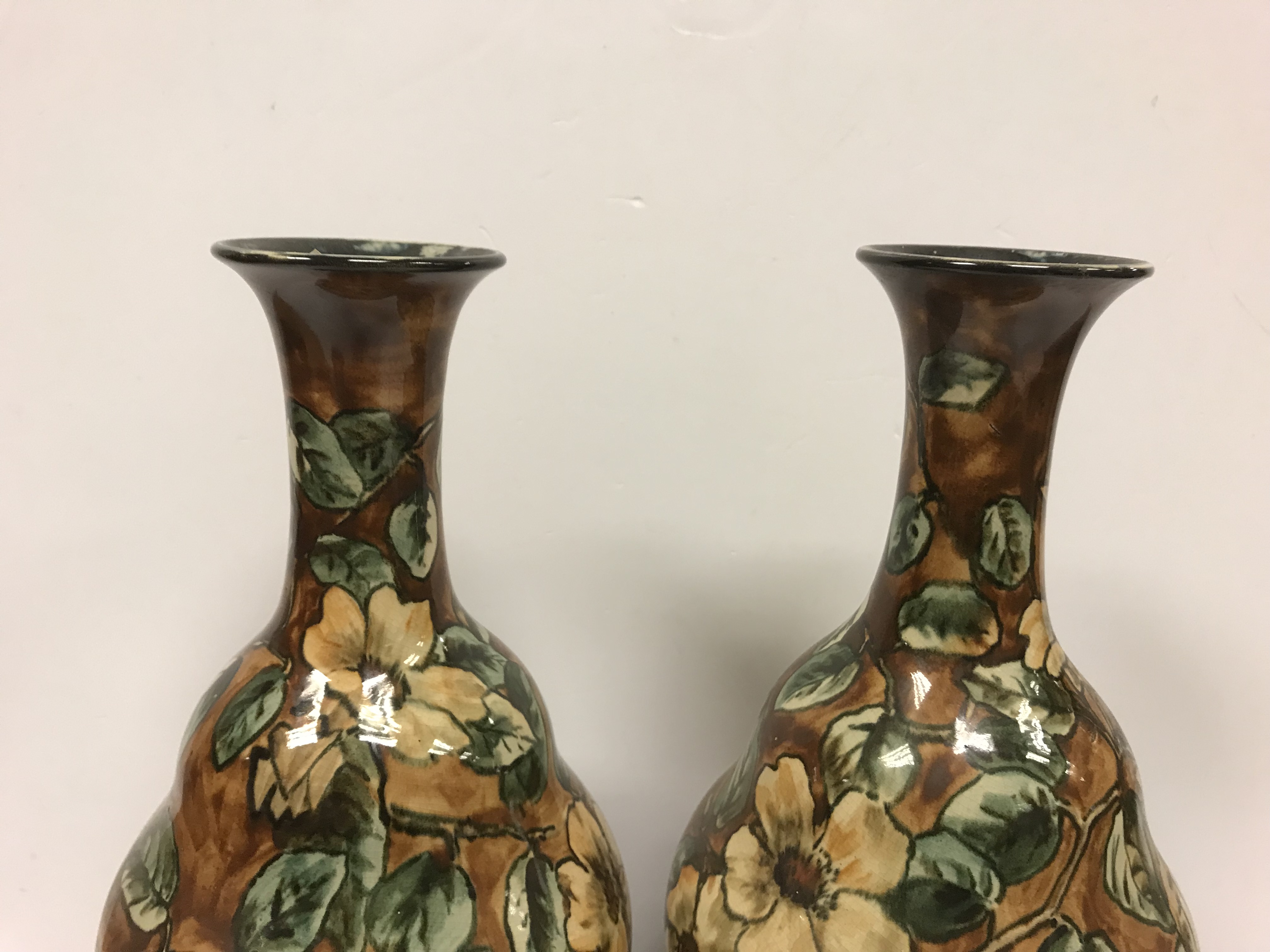 A pair of Doulton Lambeth faience ware vases, the brown ground set with floral decoration, - Image 8 of 22