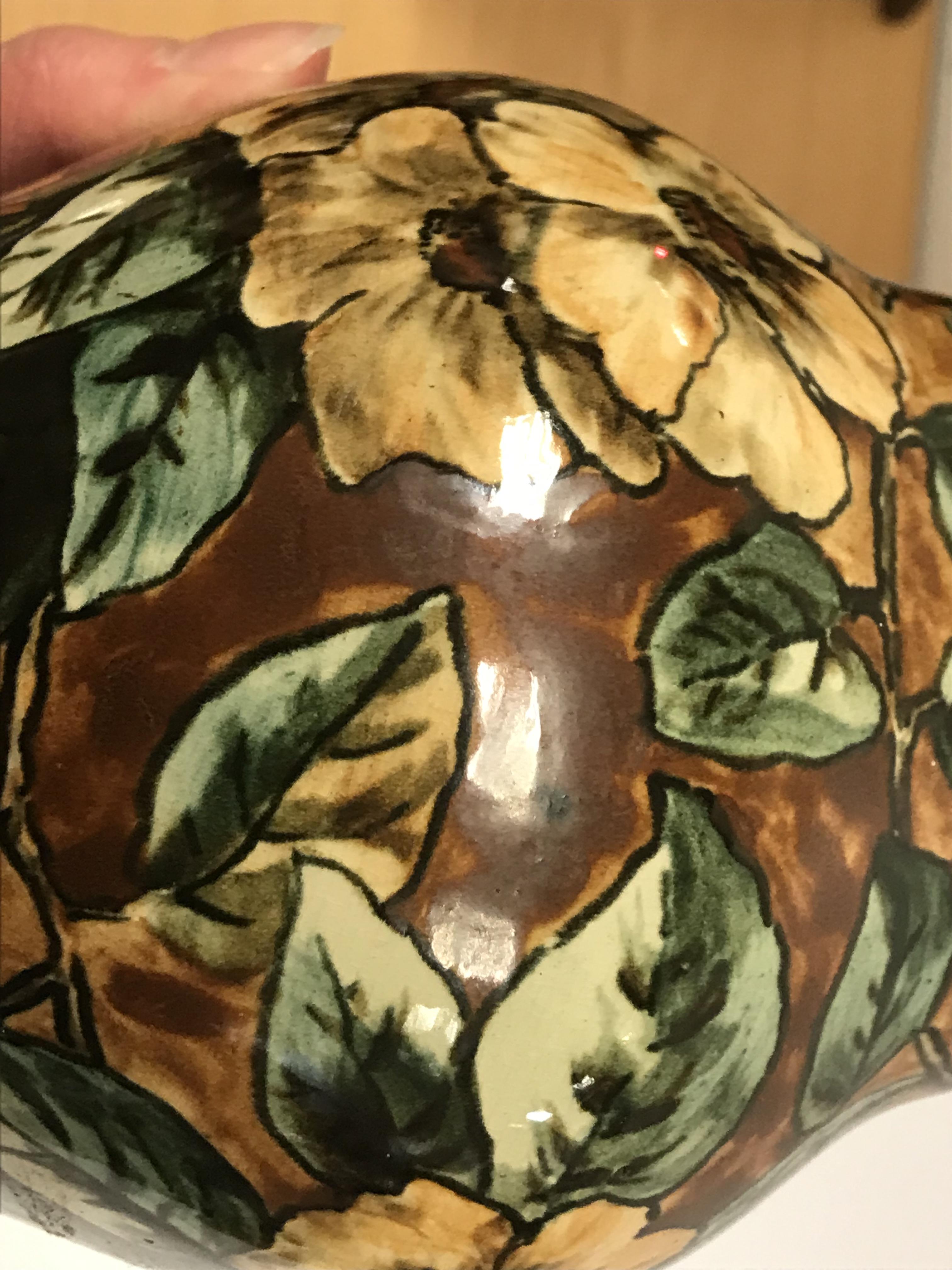 A pair of Doulton Lambeth faience ware vases, the brown ground set with floral decoration, - Image 18 of 22
