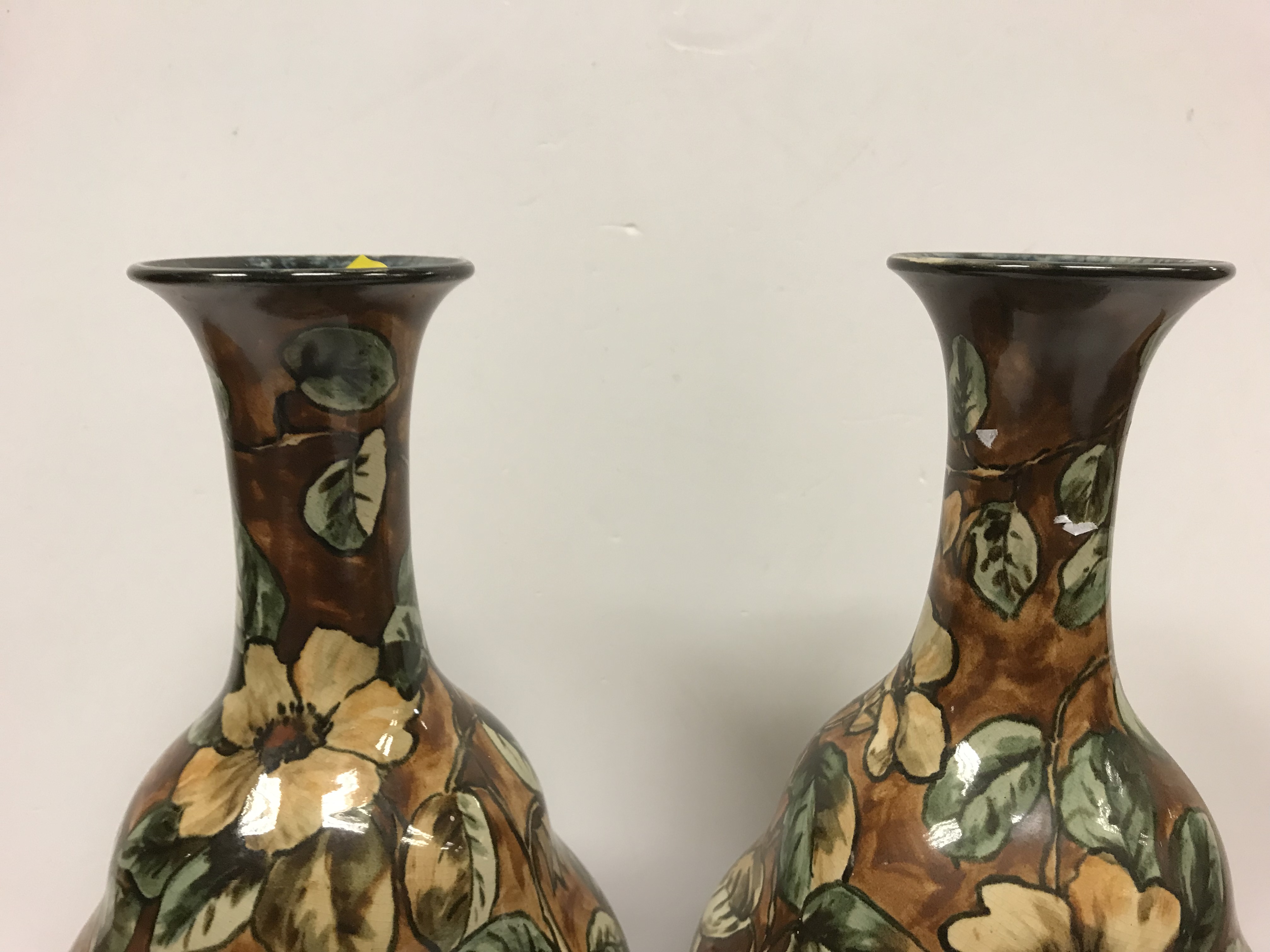 A pair of Doulton Lambeth faience ware vases, the brown ground set with floral decoration, - Image 3 of 22