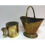 A brass coal bucket of boat form raised on a stepped foot 31 cm high excluding handle together with