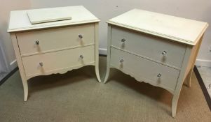 A set of four modern cream painted chests of two drawers in the 19th Century style raised on square