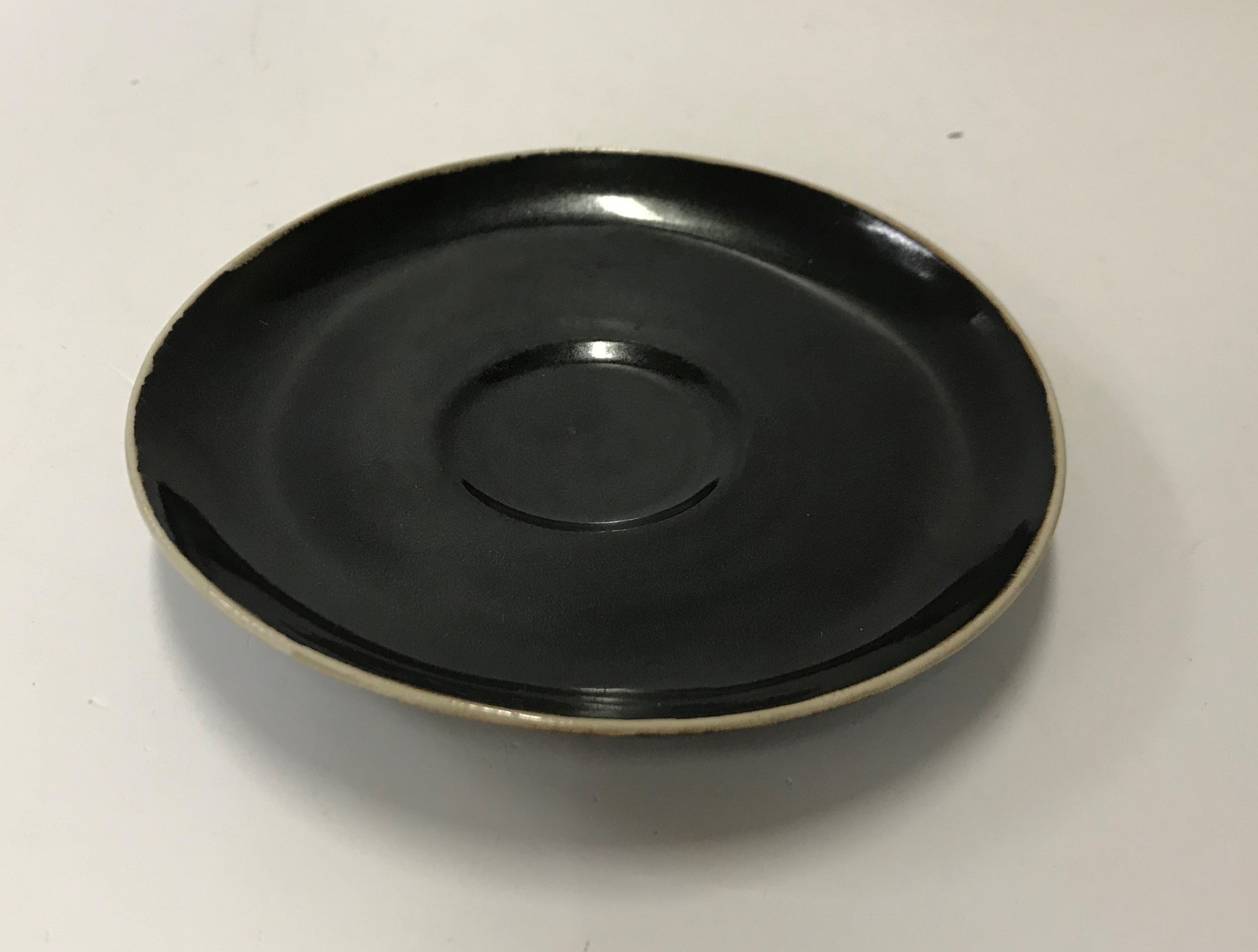 A Lucie Rie black glazed elliptical bowl and saucer, both bearing Lucie Rie marks, - Image 2 of 13